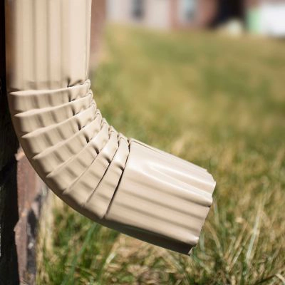 curved gutter drain directing water away from a building
