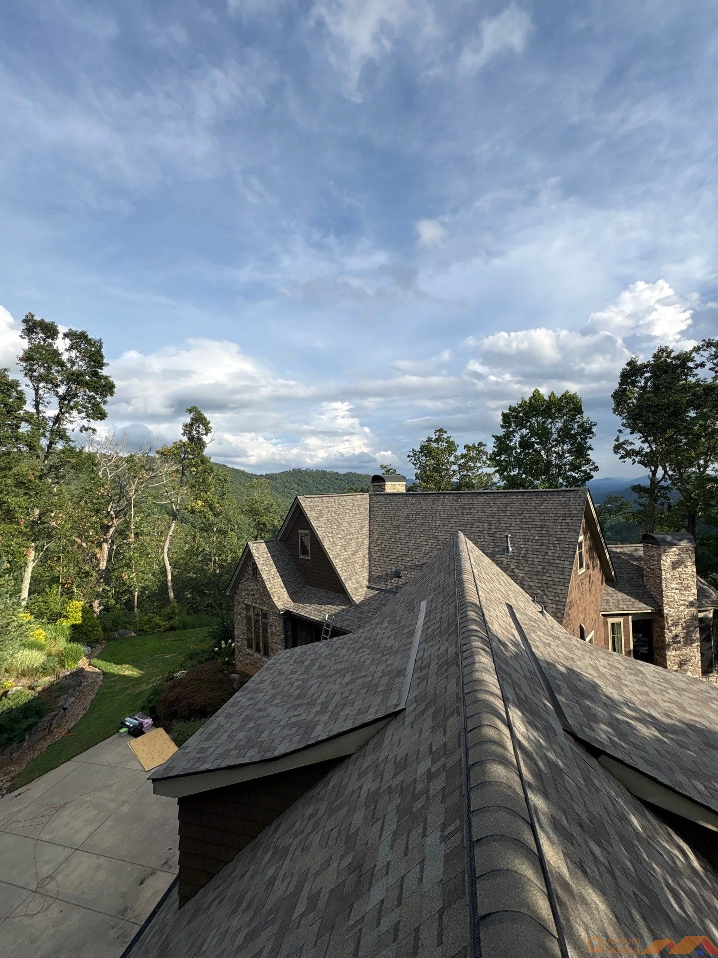 After image of a completed residential roof replacement in Asheville, NC featuring Owens Corning Duration shingles, clean ridge lines, and improved ventilation.