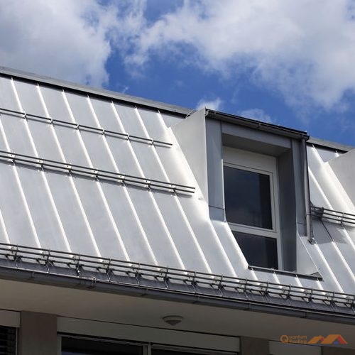 Metal Standing Seam Roof Against Blue Sky